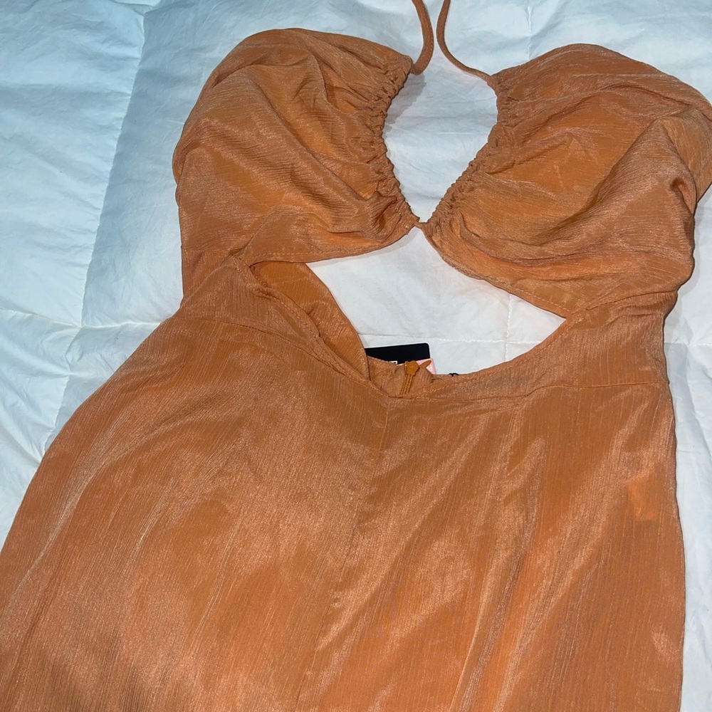 Pretty little thing jumpsuit. Brand new with tags. Halter with cut out.